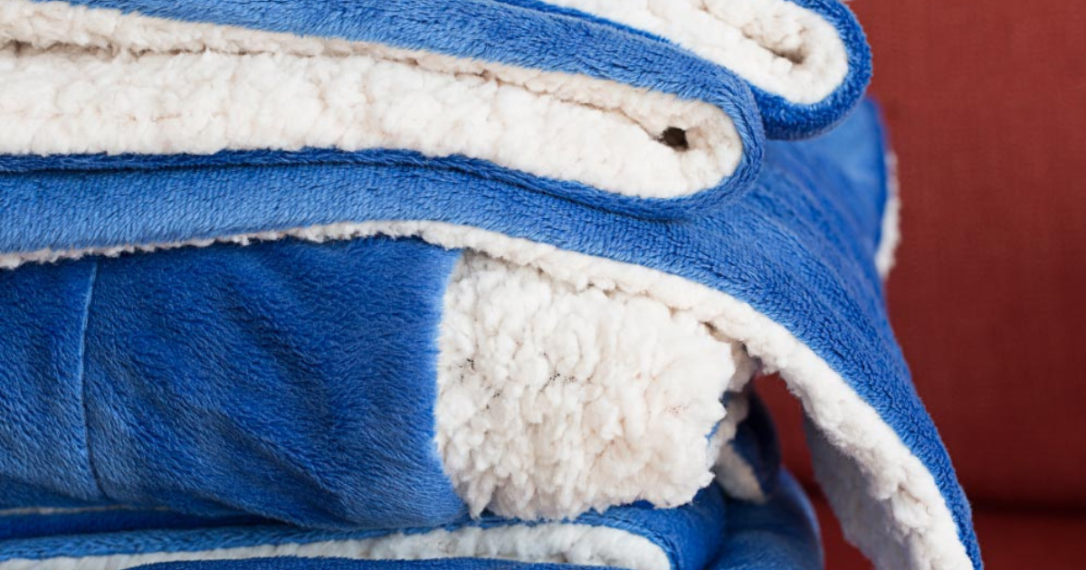 Wholesale blue sherpa blankets staked